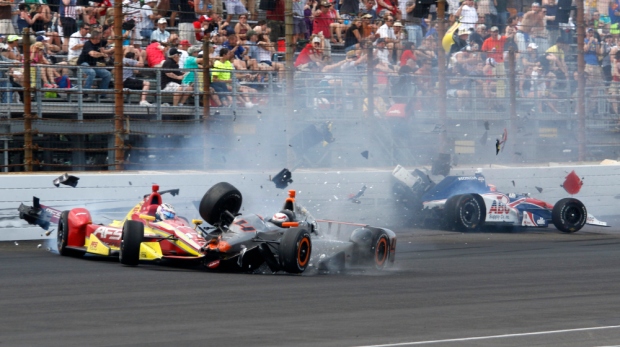 Stefano Coletti, of Monaco, (4) hits the car driven by Sebastian Saavedra, of Colombia, as Jack Hawksworth, right, of England, hits the wall in the closing laps of the 99th running of the Indianapolis 500 auto race at Indianapolis Motor Speedway in Indianapolis, Sunday, May 24, 2015.  (AP Photo/Kirk Stierwalt) ORG XMIT: NAA147